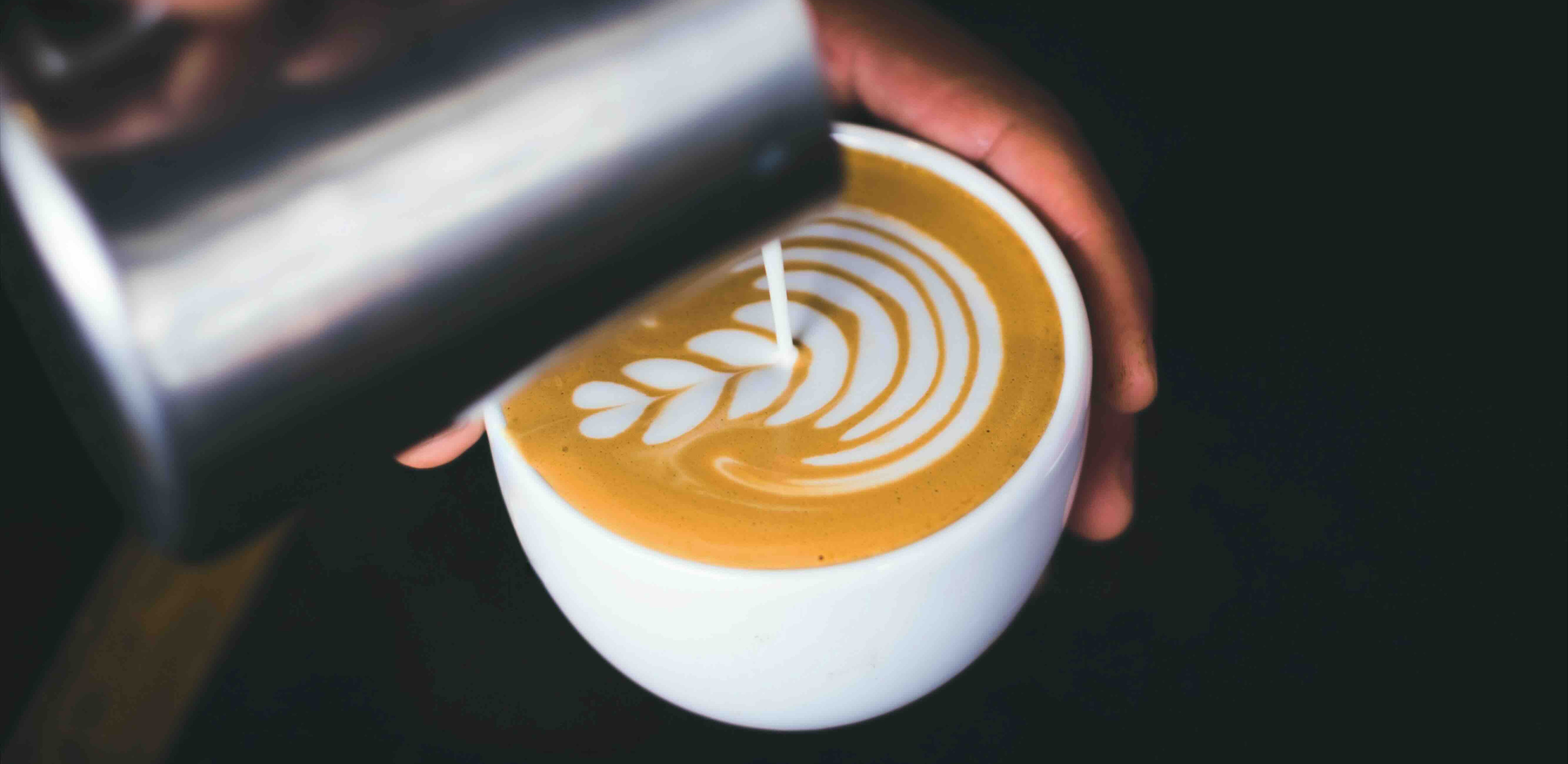 Image of latte art being created by a Cornish Coffee expert.