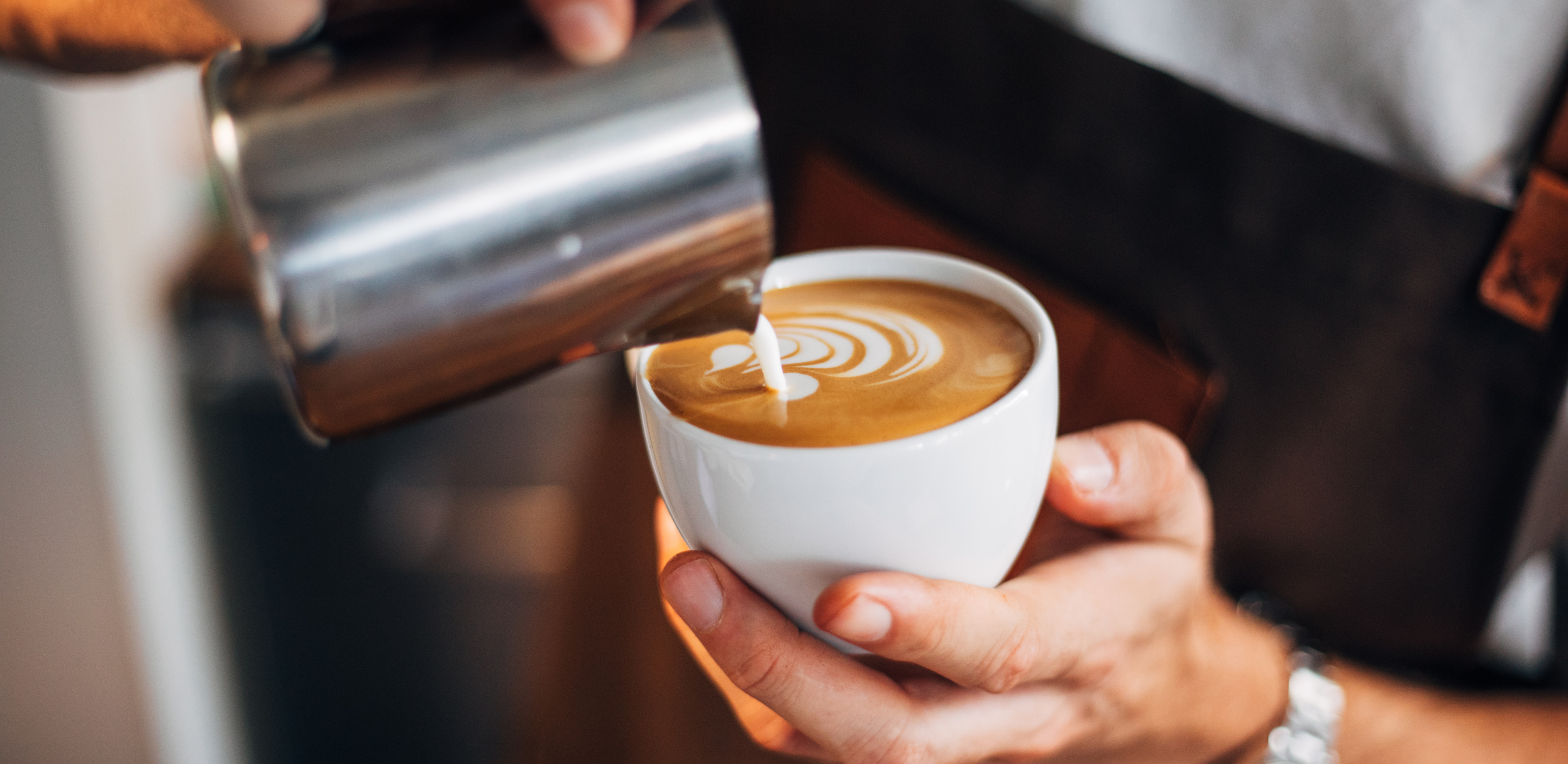 Latte art being created with Cornish Coffee